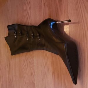 Black high heel stiletto boots a little below mid calf